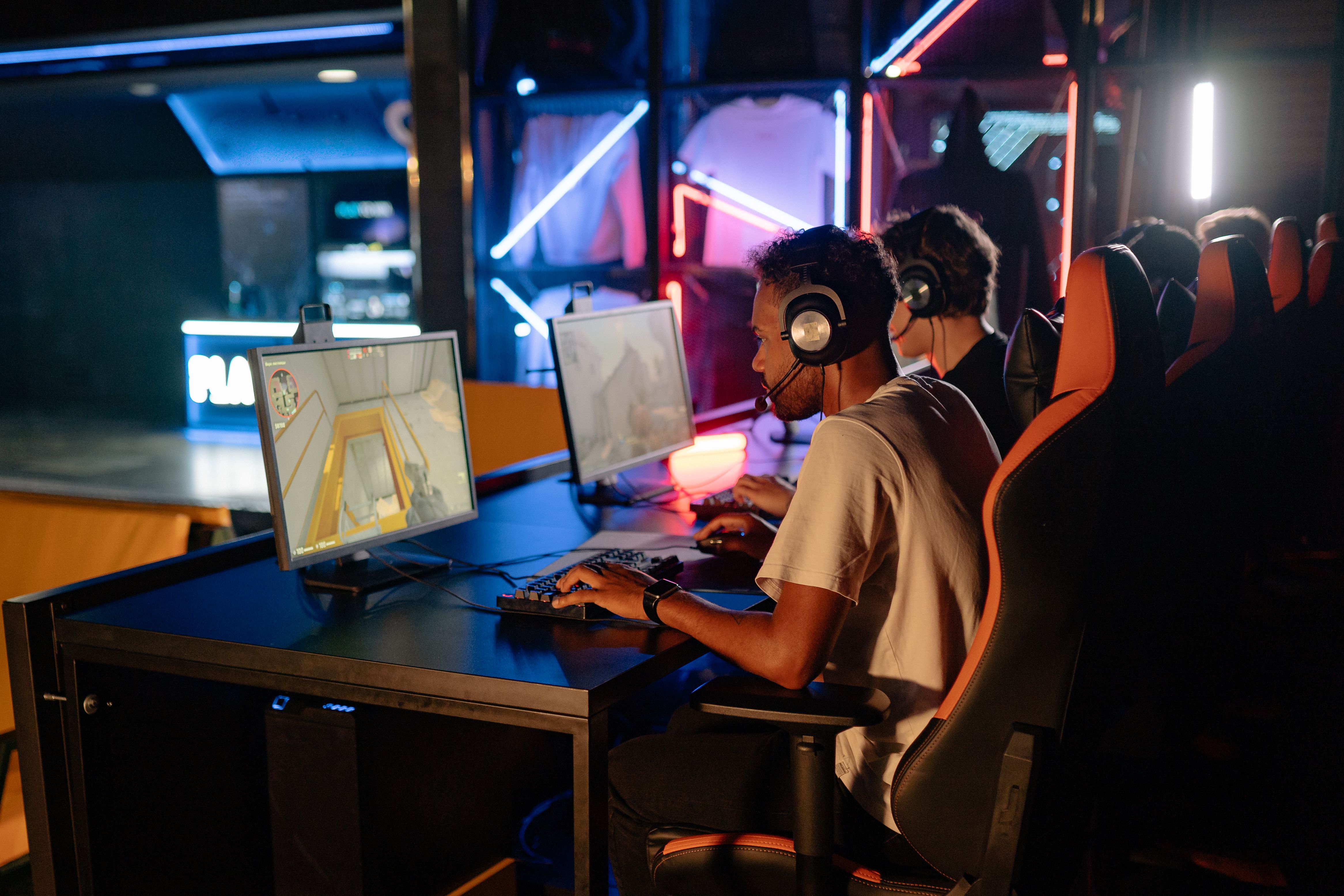 Game players at computer stations representing the final experience being tested