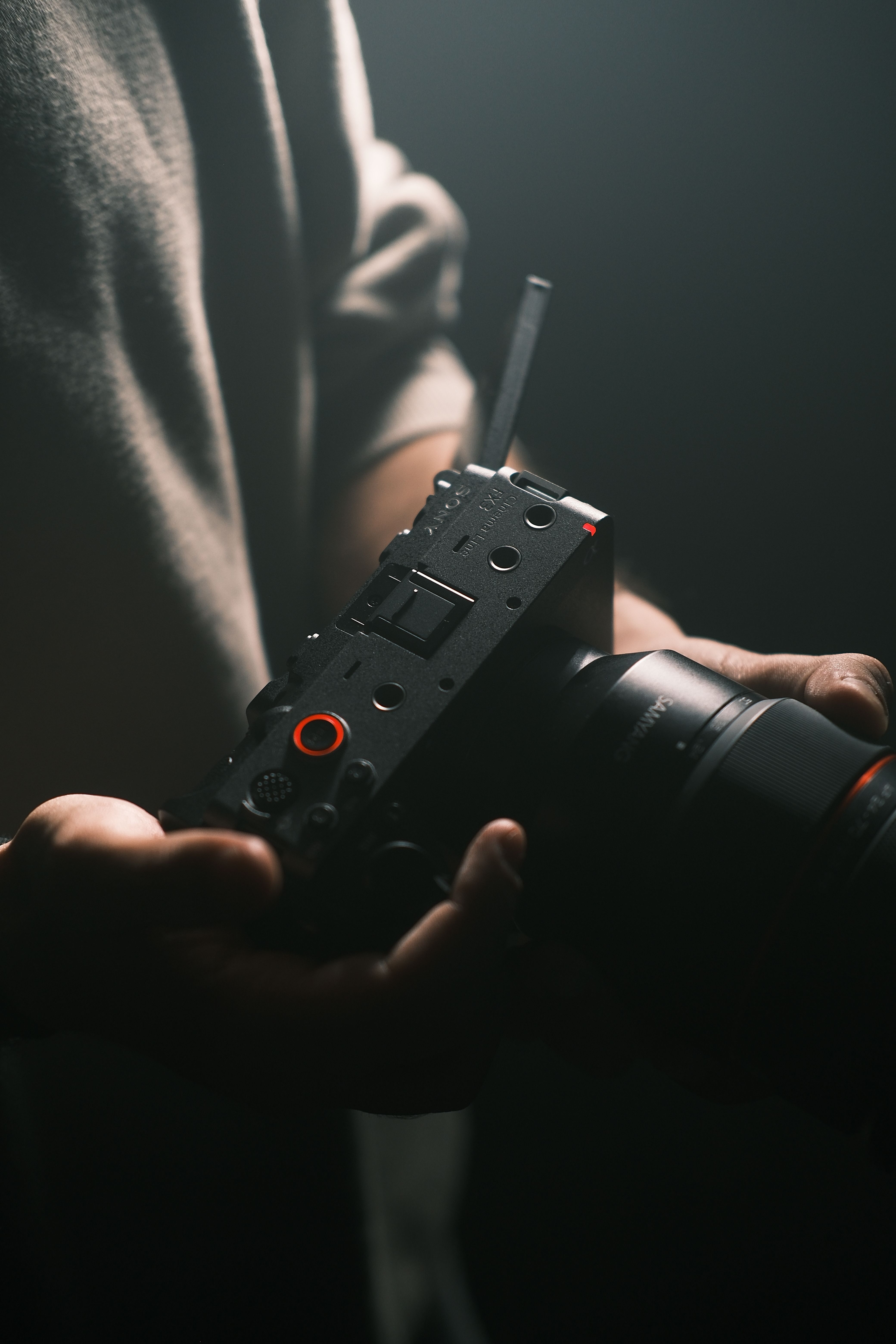 Filmmaker checking detailed facial capture footage on a professional camera