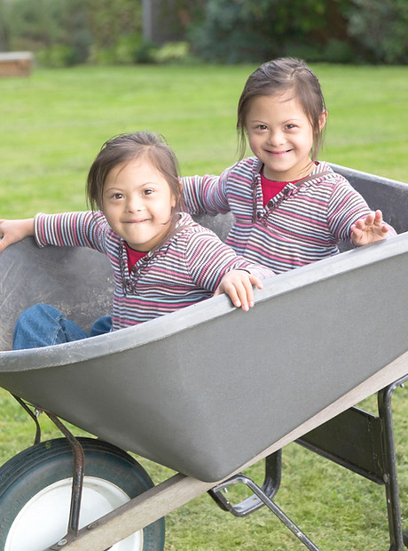 Twins with Down Syndrome in Wheelbarrow