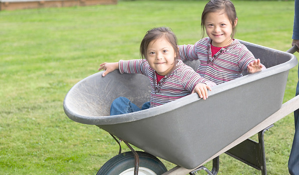 Twins with Down Syndrome in Wheelbarrow