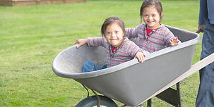Twins with Down Syndrome in Wheelbarrow