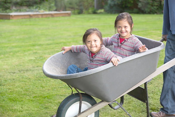 Twins with Down Syndrome in Wheelbarrow