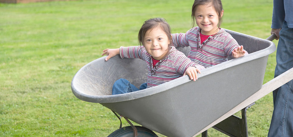Twins with Down Syndrome in Wheelbarrow