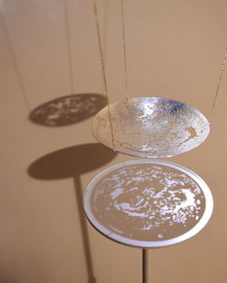 3_Stellar Shadows_Silver (recycled), Gold-Plated Chain, Iron Stand, MDF, Spotlight_400x300
