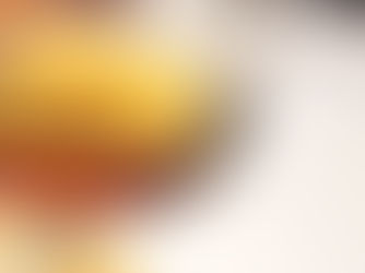 Snifter with amber liquid in it.