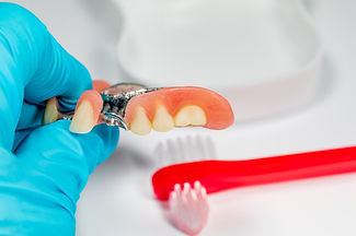 Partial denture and toothbrush