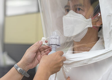 Respirator fit test prepared for COVID-19. Asia doctor testing repiratory system with N-95