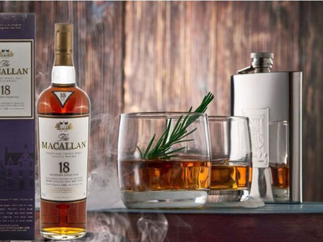 macallan 18 whisky with a glass of drink on a table