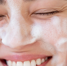 portrait-beautiful-woman-with-clear-skin-washing-face-with-foam-cleanser.jpg