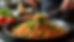 Close-up view of a traditional Mexican dish being prepared with fresh ingredients
