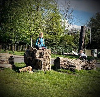 child meditating outdoors