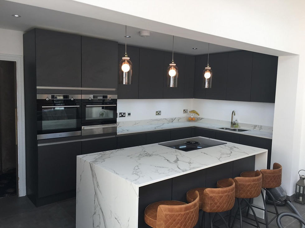 kitchens-navy-kitchen cupboards-oven-marble Island -marble-counter-black-tan-suede-leather-bar-stools-three-glass-pendant-lights