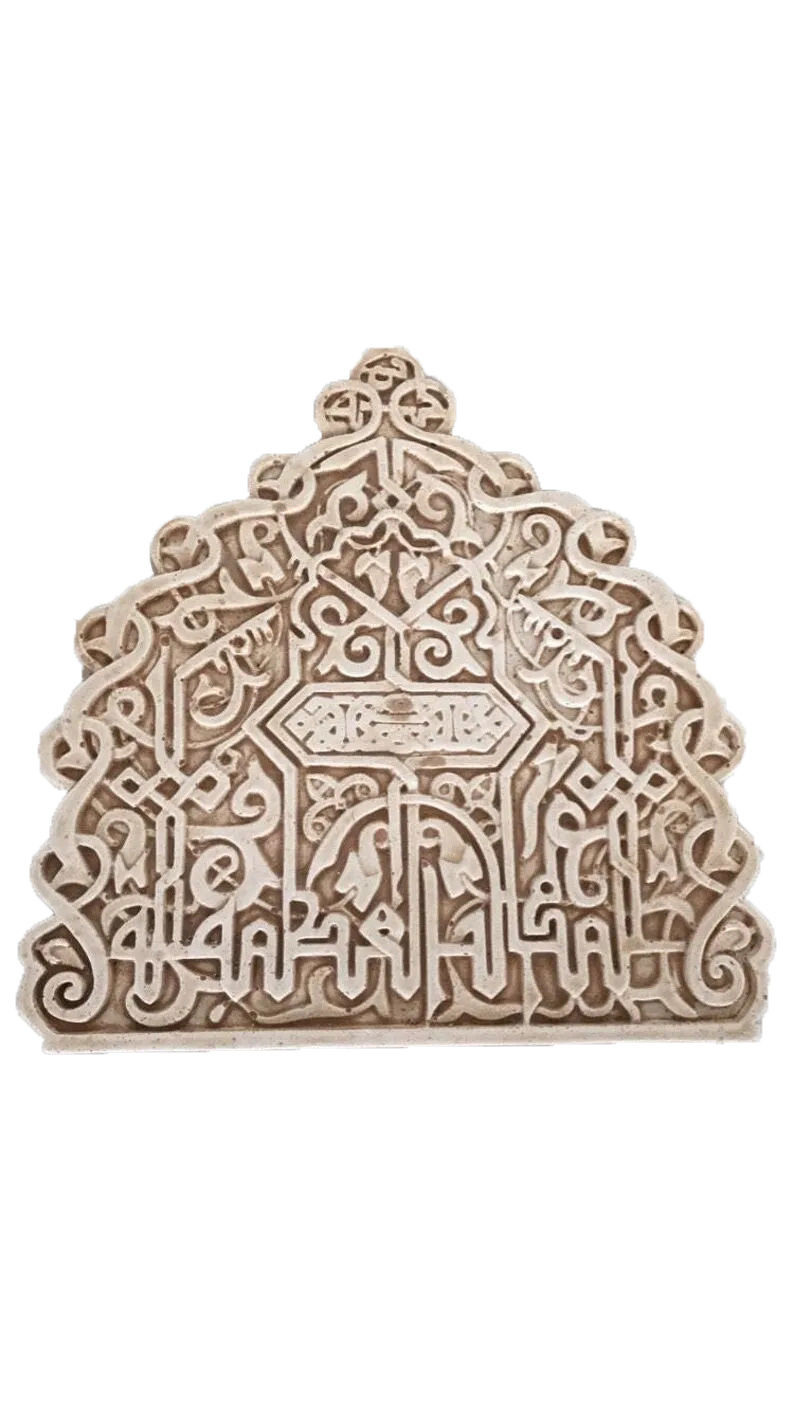 Moroccan-style plaster carving with repeating lattice motifs