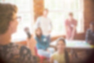 Photo of a woman speaking at a retreat