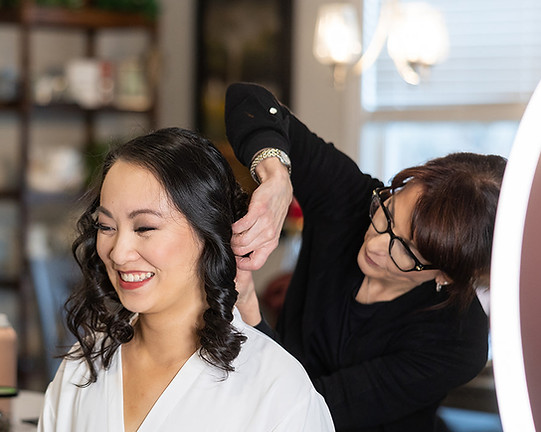 HT Salon Alpharetta professional team styling a wedding party for a special day
