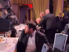 Dramatic Images Show the Moment Donald Trump is Rushed Off Stage as Gunman Targets Event