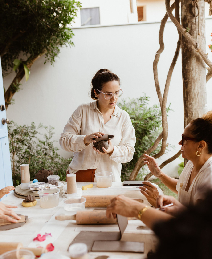 An artist sharing a technique with a guest