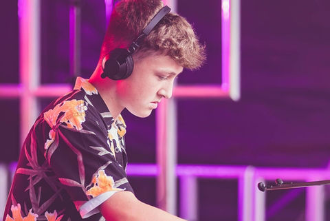 DJ with headphones playing music, best dj sax cornwall devon