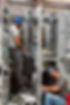 Point Eight Power employees install wiring into a switch-gear panel being manufactured at their Port Bienville Industrial Park facility.