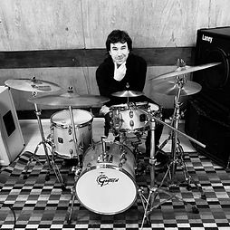 Melinda, online vocal and songwriting coach at Inspired Playing, singing and playing piano during a concert performance.