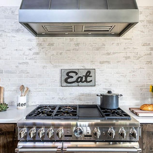 Rustic kitchen with white brick backsplash
