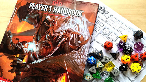 Dungeons & Dragons Player's Handbook with a collection of colourful multi-sided dice.