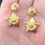 Thumbnail: Trillium Flower & Star Drop Earrings in 18k Yellow Gold 
