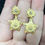 Thumbnail: Trillium Flower & Star Drop Earrings in 18k Yellow Gold 