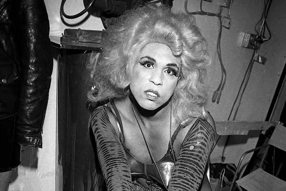 Vaginal Davis performing in punk-grotesque drag, representing anti-norm queer cultural resistance.