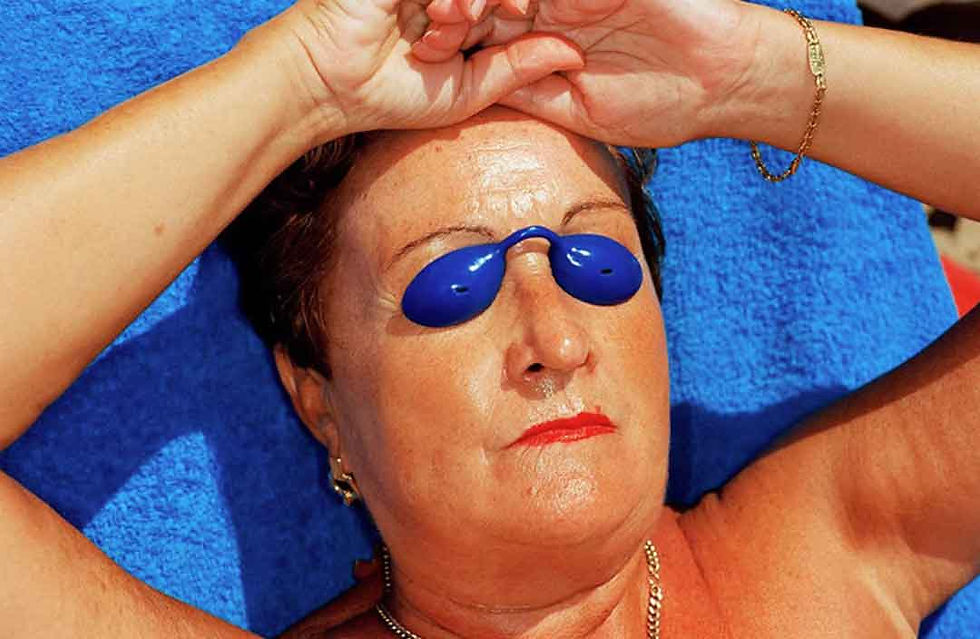 Martin Parr photograph at artificial beach in Miyazaki Japan, showcasing his signature saturated documentary style