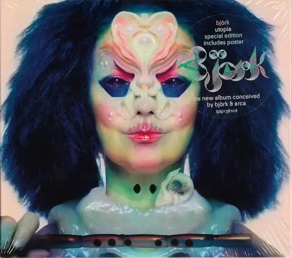 Björk album cover with surreal face paint and dark hair; text reads Utopia special edition includes poster.