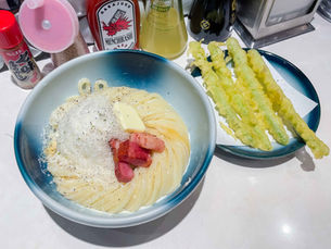 Carbonara udon with cheese, butter, and bacon. 4 sticks of asparagus tempura.