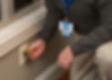 Home inspector using an electrical outlet tester to check for wiring issues during a thorough home inspection