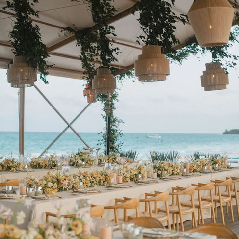 Elegant outdoor wedding reception setup overlooking the ocean in Los Cabos destination wedding