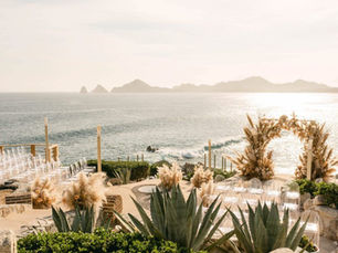 Wedding ceremony in Los Cabos with ocean view and romantic atmosphere.