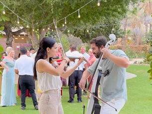 Violin and Cello duo playing at Flora Farms wedding in Los Cabos.