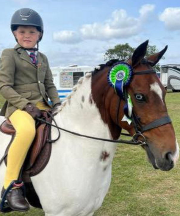 Child and rosettes