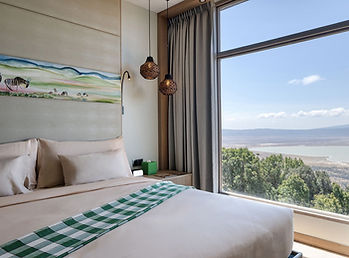Ngorongoro Lodge Meliá Collection, a double room with floor to ceiling window view looking over the Ngorongoro crater
