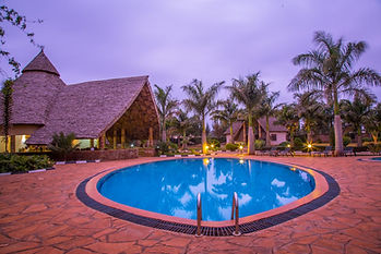 Farm of Dreams Lodge Karatu , Tanzania Pool area of this beautiful hotel with double and family lodges