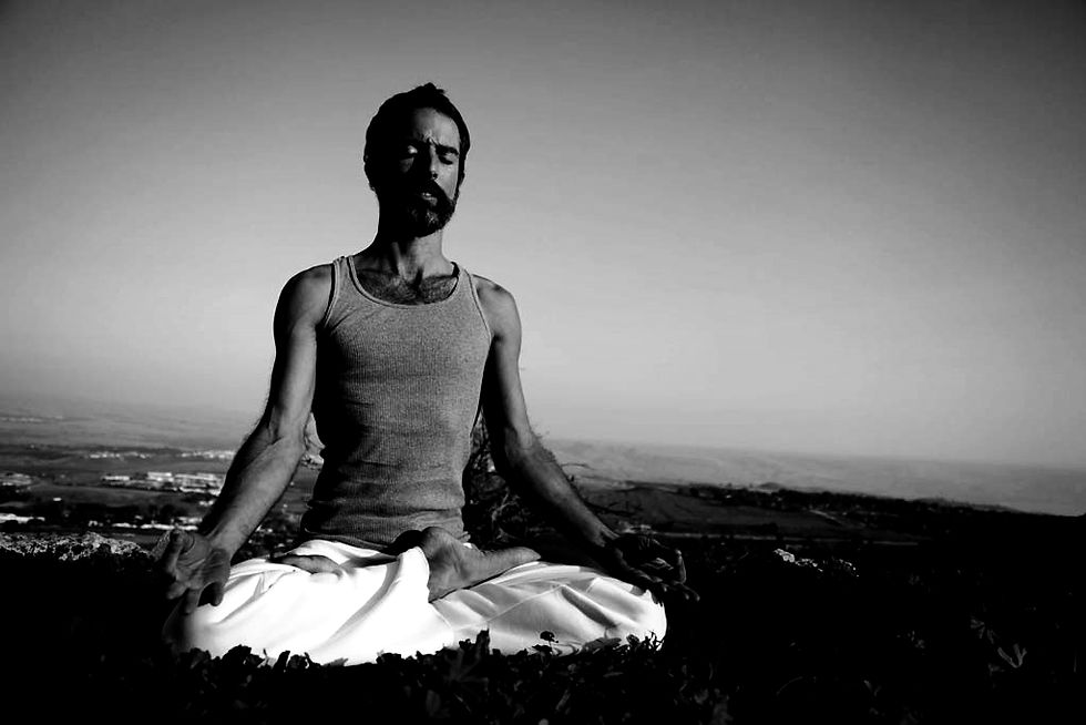 Eye-level view of a serene yoga space with candles and mats