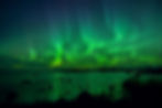 Northern lights reflected in water