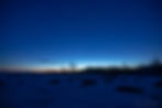 Night sky at an icy shoreline