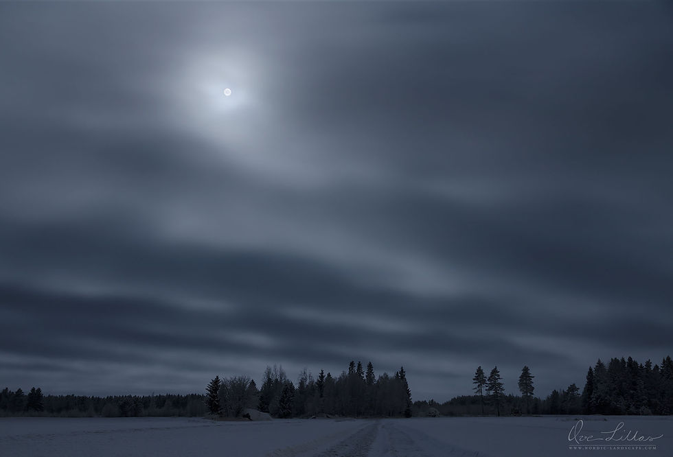 Moon behind cloud cover.