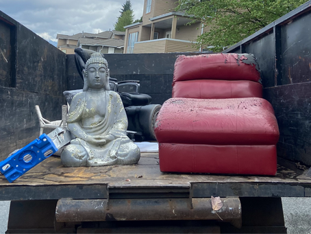 A Junk Solved junk removal truck and furniture, ready for furniture disposal