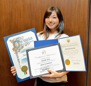 Smiling woman holding three certificates