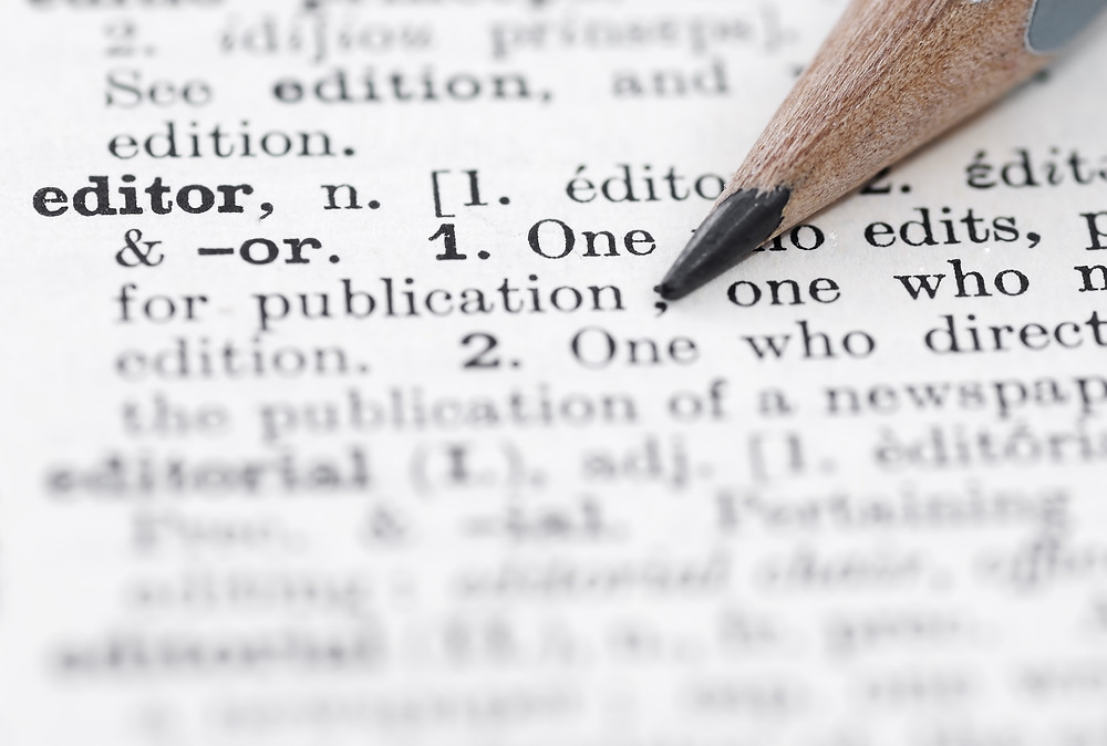 Dictionary definition of editor and a sharpened pencil