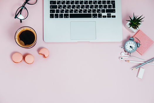 Pink desktop, coffe, clock and laptop