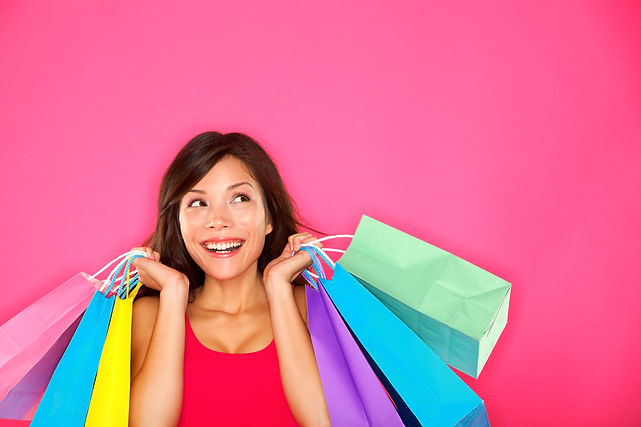 Happy woman with colorful shopping bags