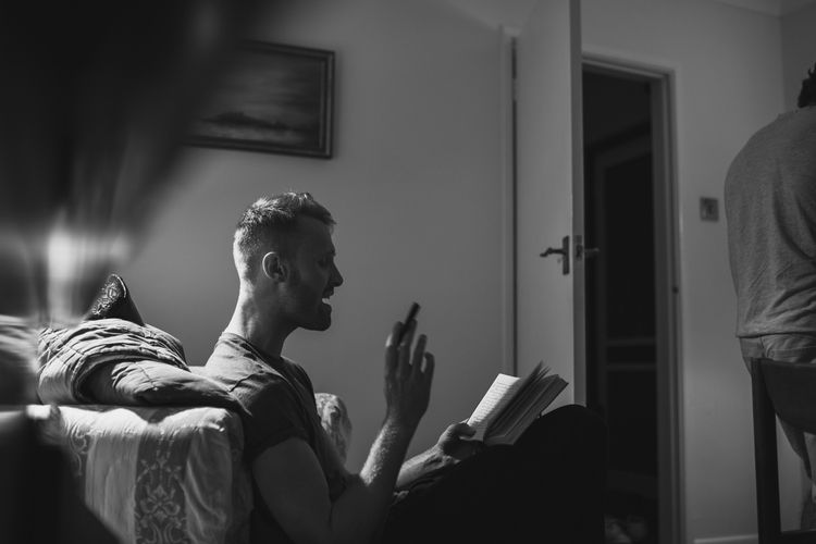 man reading lyrics and singing