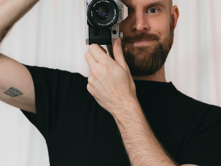 Photographer Eric Doolin poses with camera